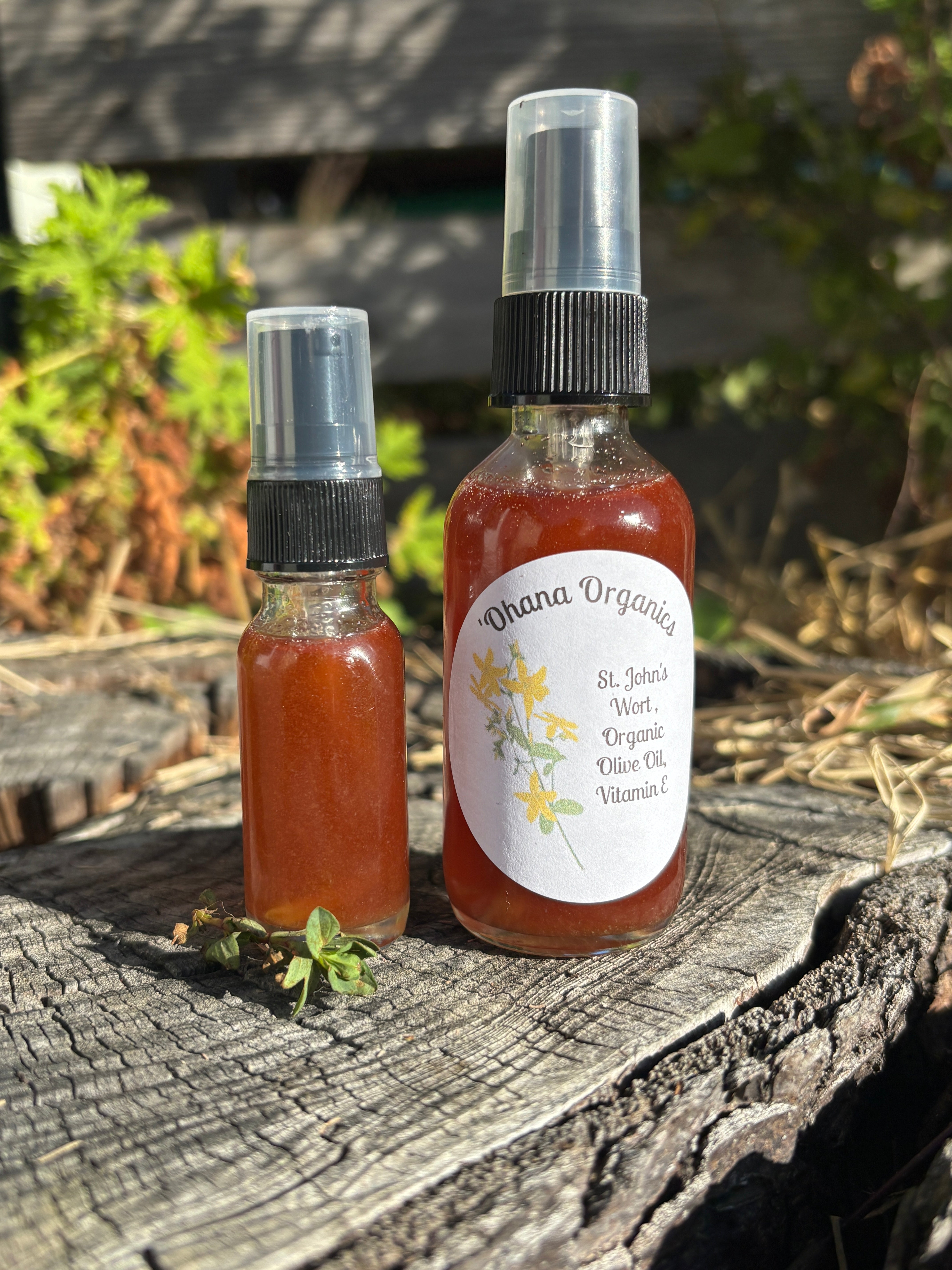 Two small bottles with labels on a wooden surface